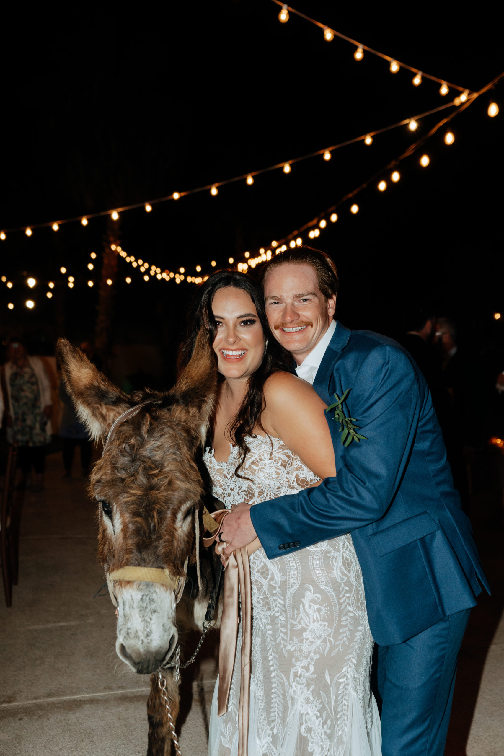 bride and groom next to camel