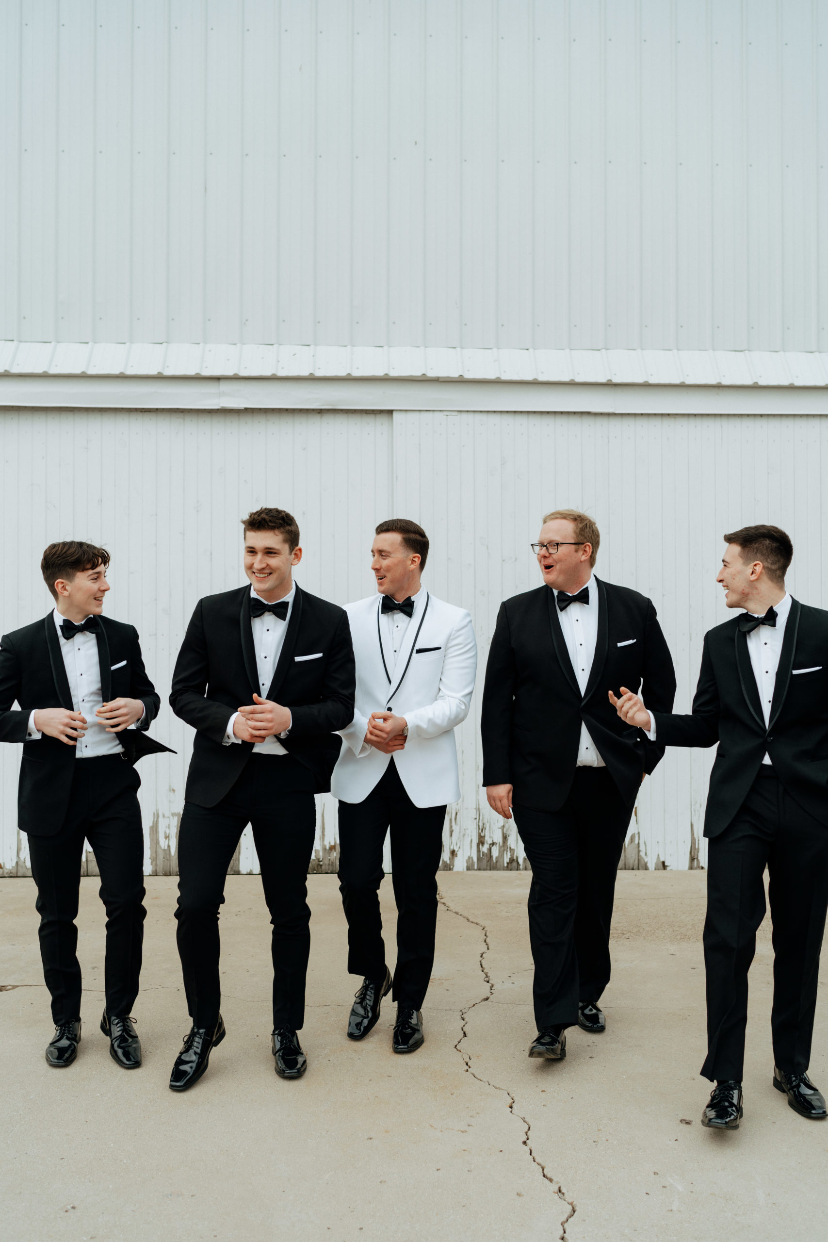 This is a picture of a groomsmen party taking pictures at The Barn At Fairview Acres