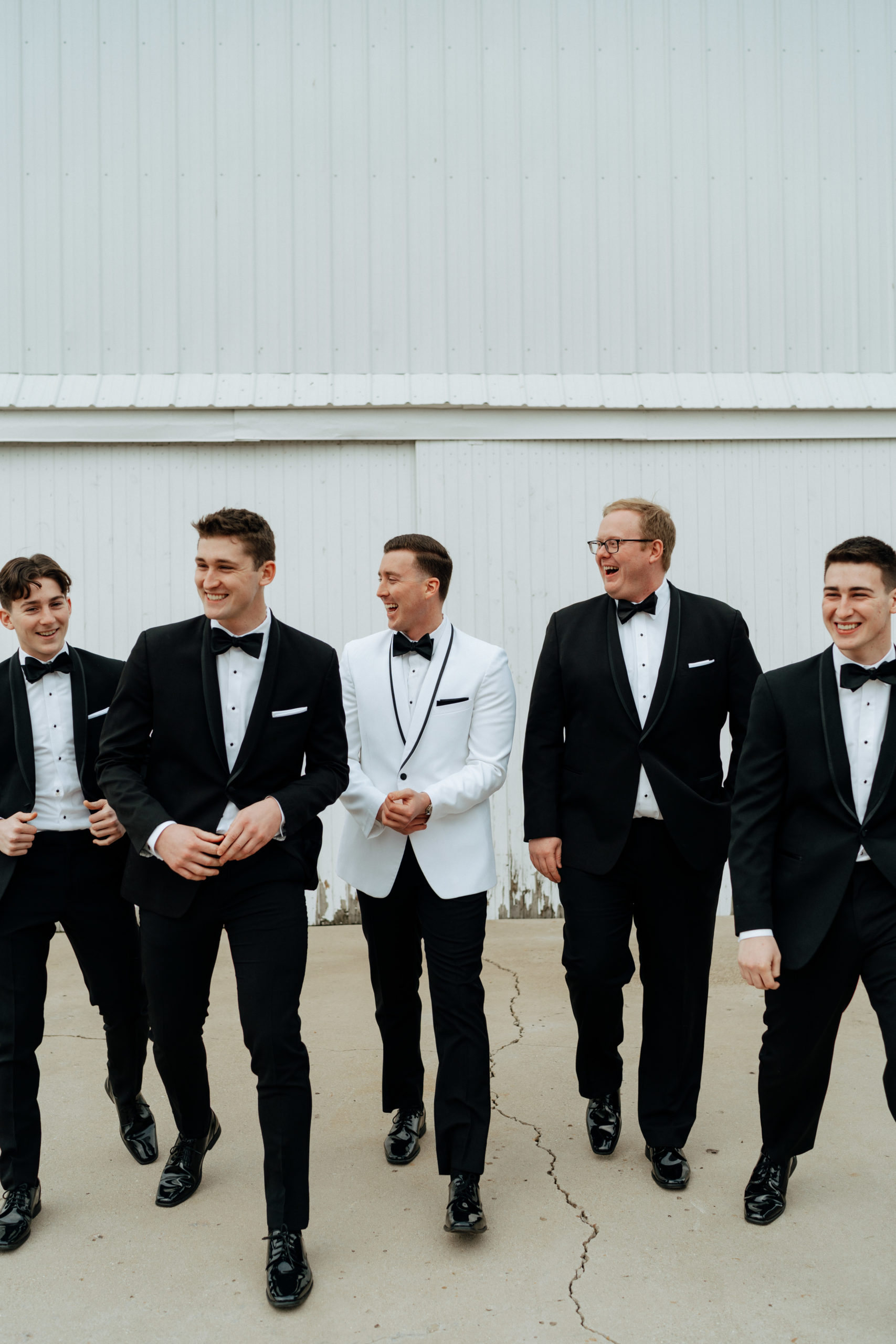 This is a picture of a groomsmen party taking pictures at The Barn At Fairview Acres