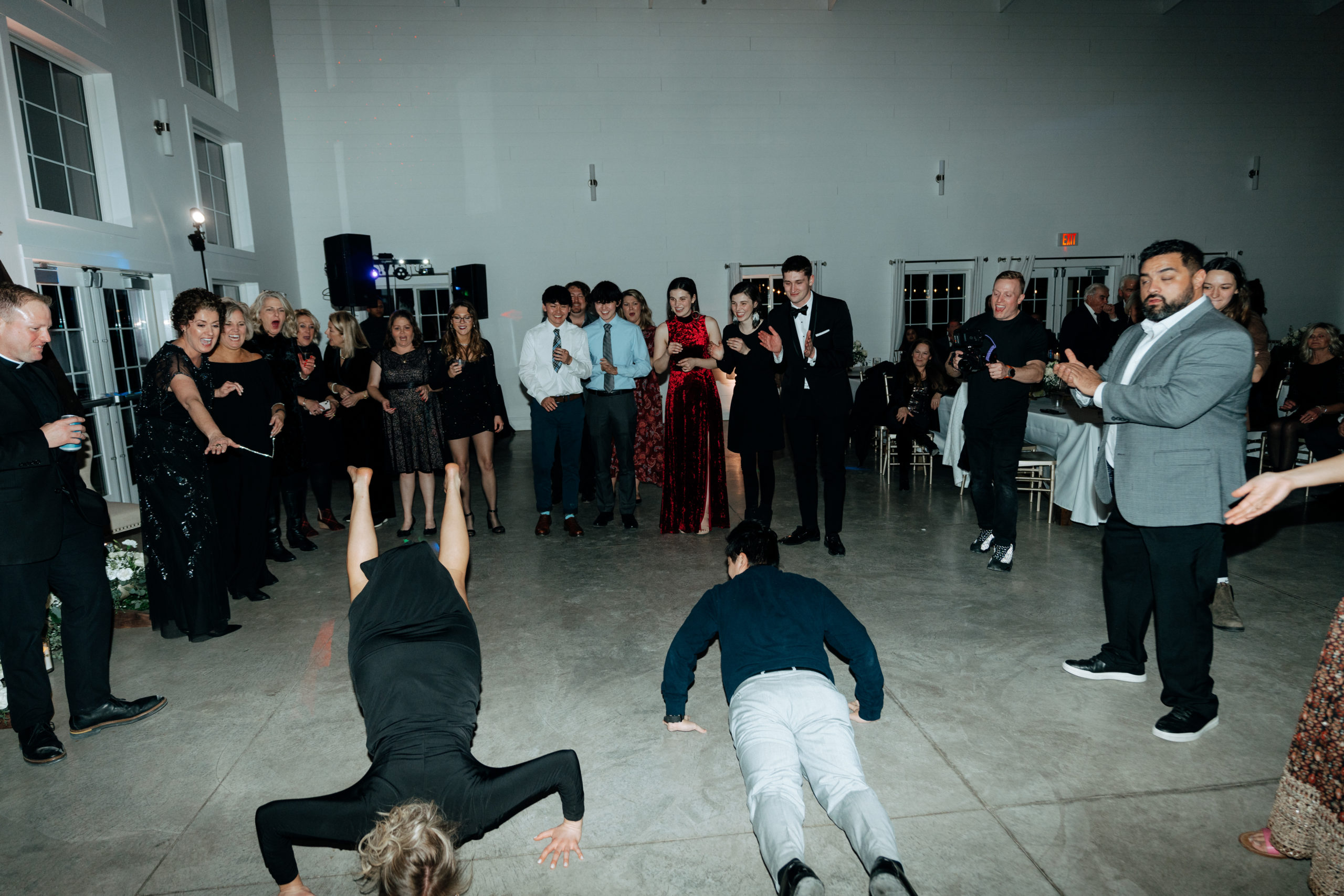 This is a picture of guests dancing at a wedding reception