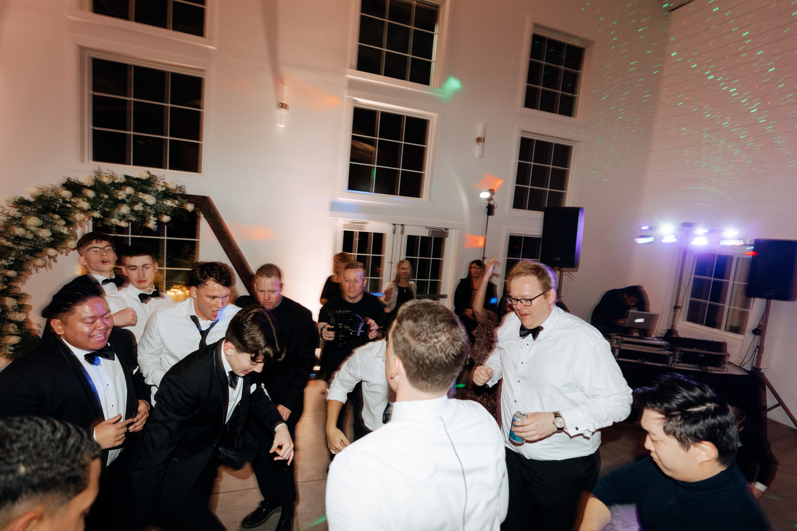 This is a picture of guests dancing at a wedding reception