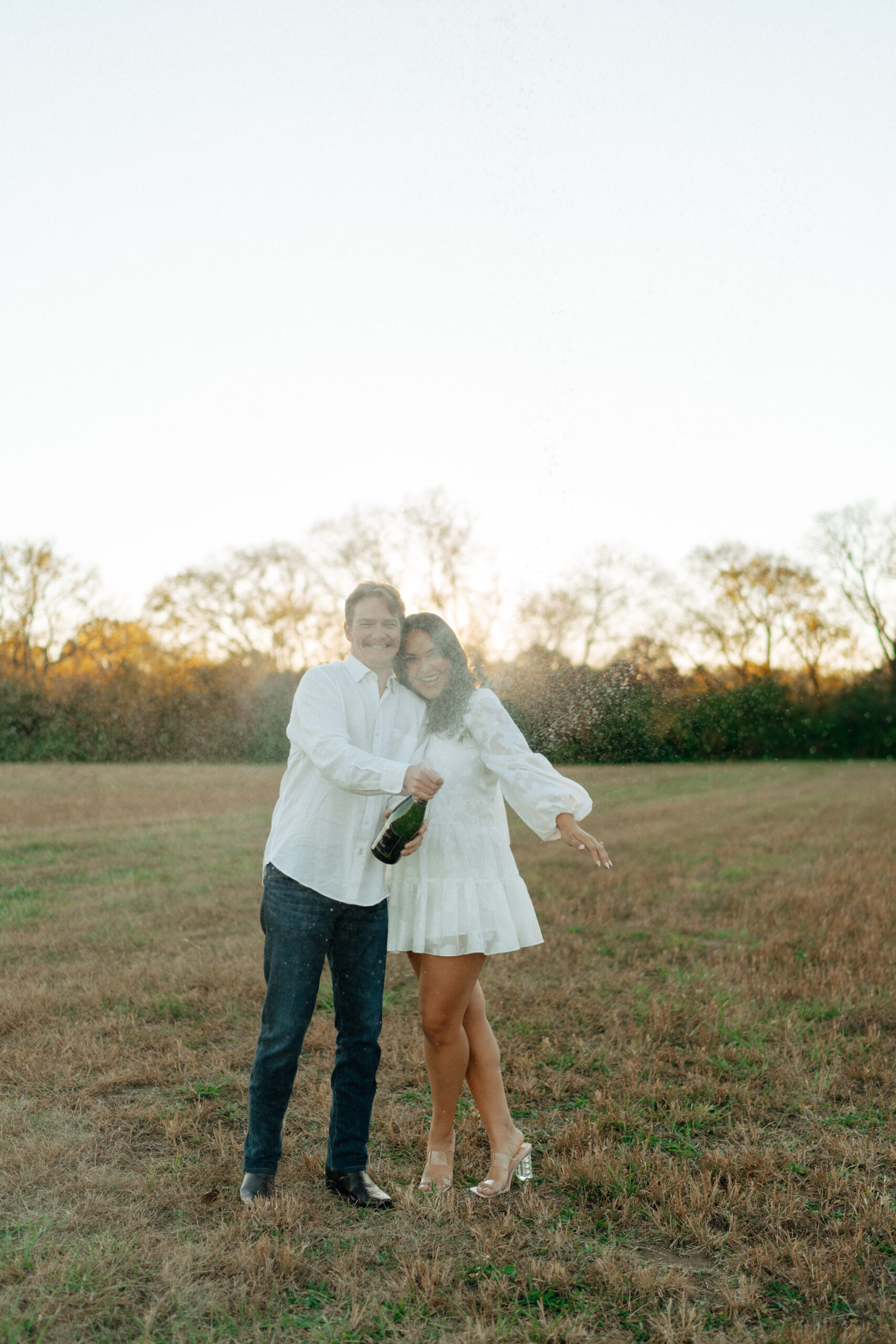 This is a couple taking pictures together for their engagement session in Franklin, TN!