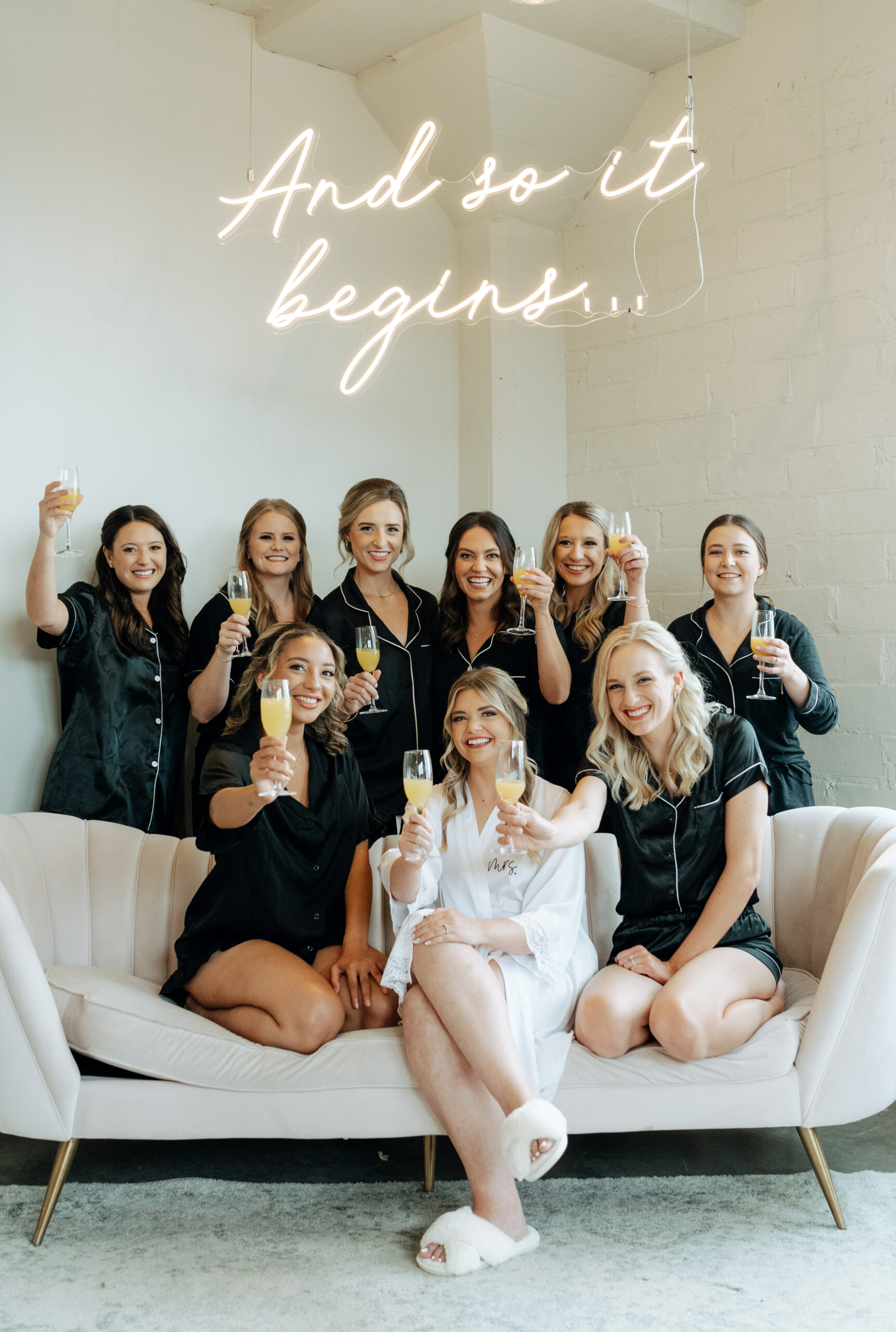 This is a picture of bridesmaids and a bride drinking champagne