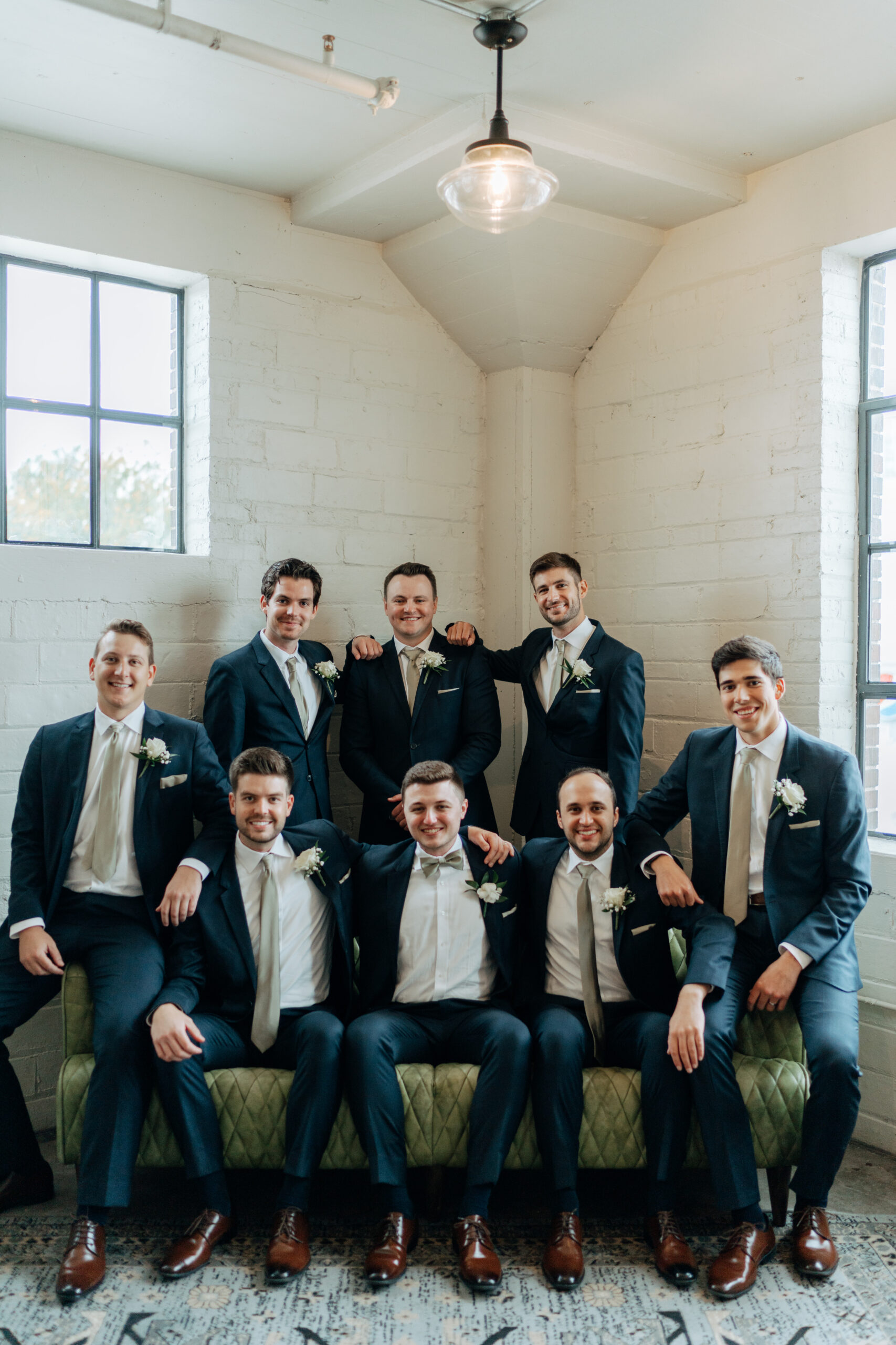 This is a picture of groomsmen taking a picture with the groom