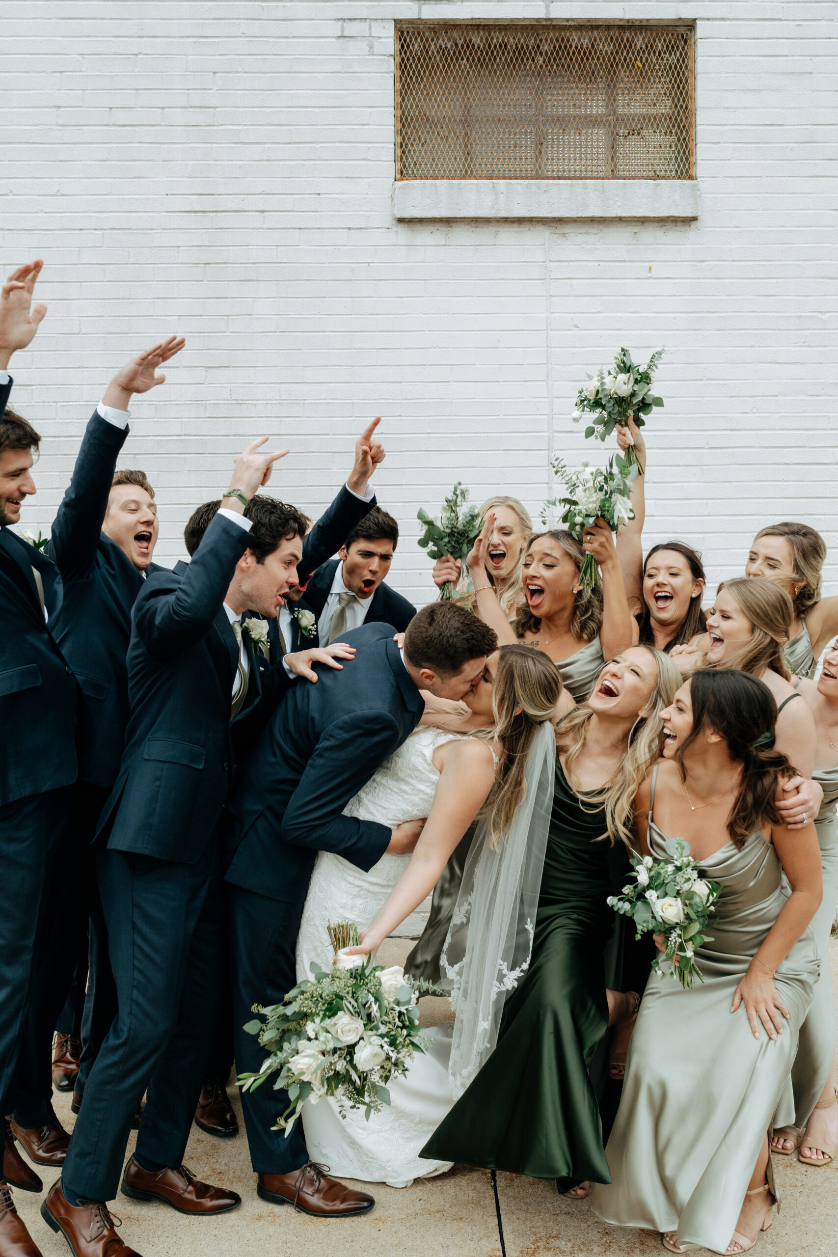 This is a picture of a bridal party taking pictures on the wedding day