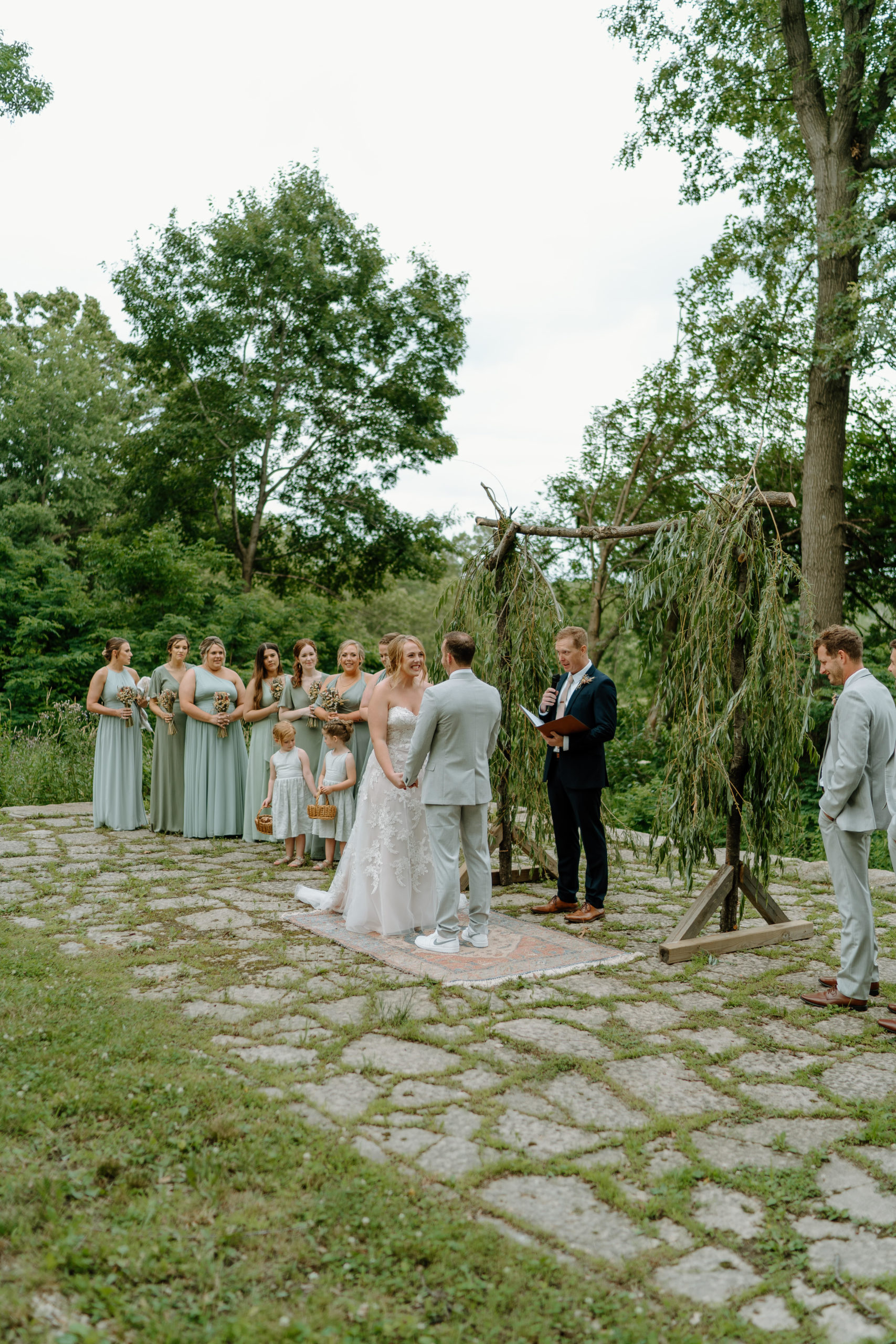 This is a wedding ceremony taking place at Indian Creek Nature Center in Cedar Rapids, IA