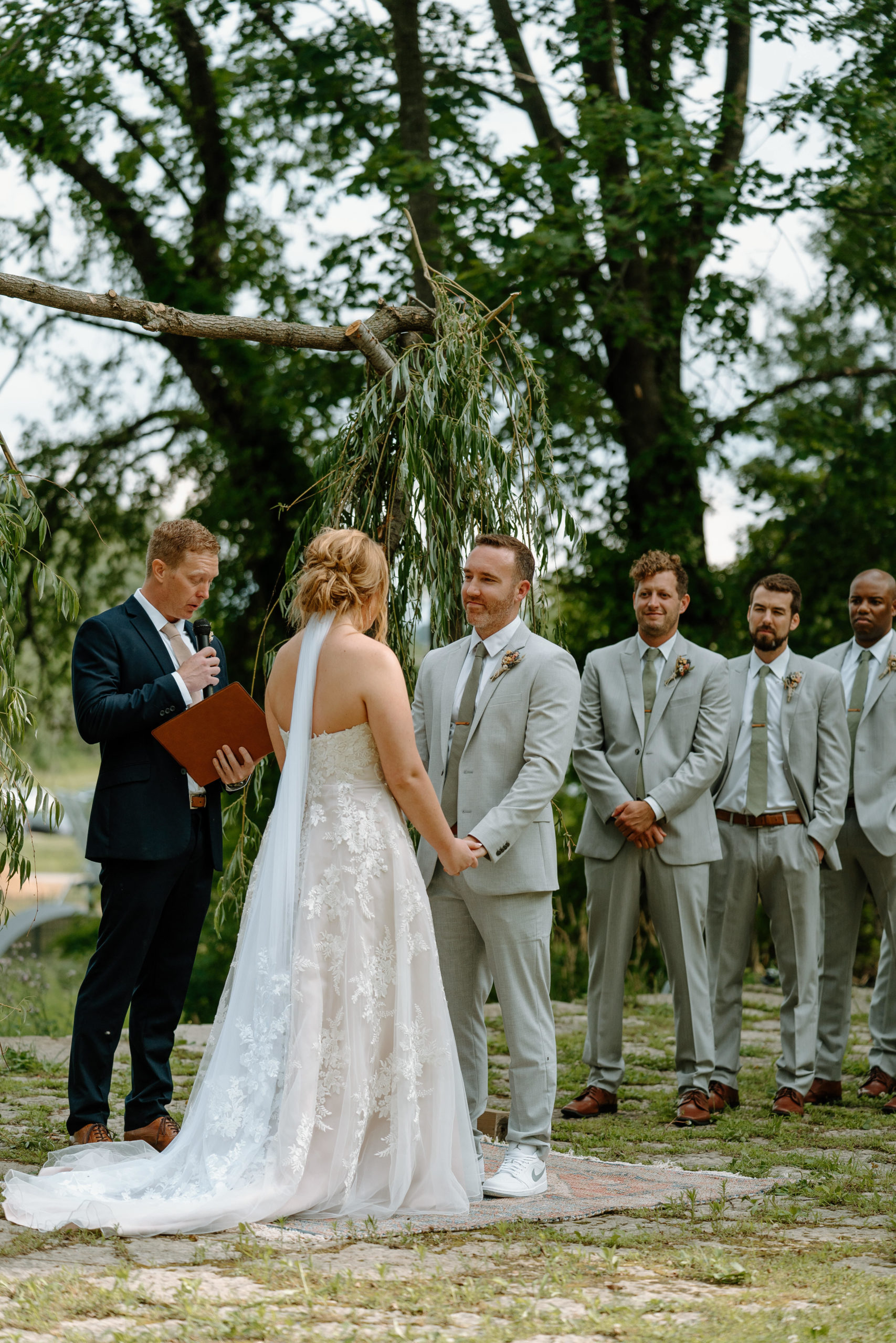 This is a wedding ceremony taking place at Indian Creek Nature Center in Cedar Rapids, IA