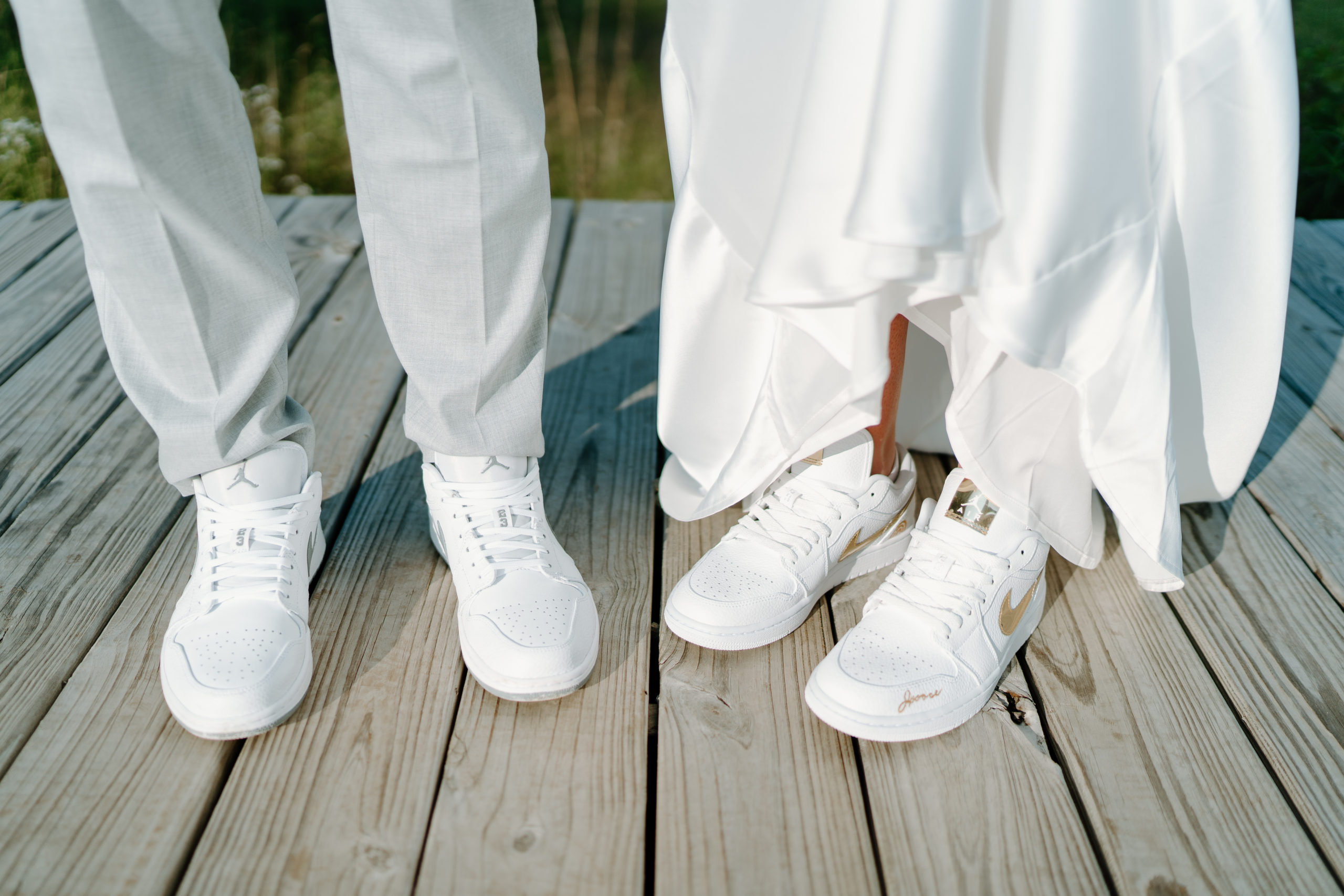 This is a bride and groom wearing jordans on their wedding day