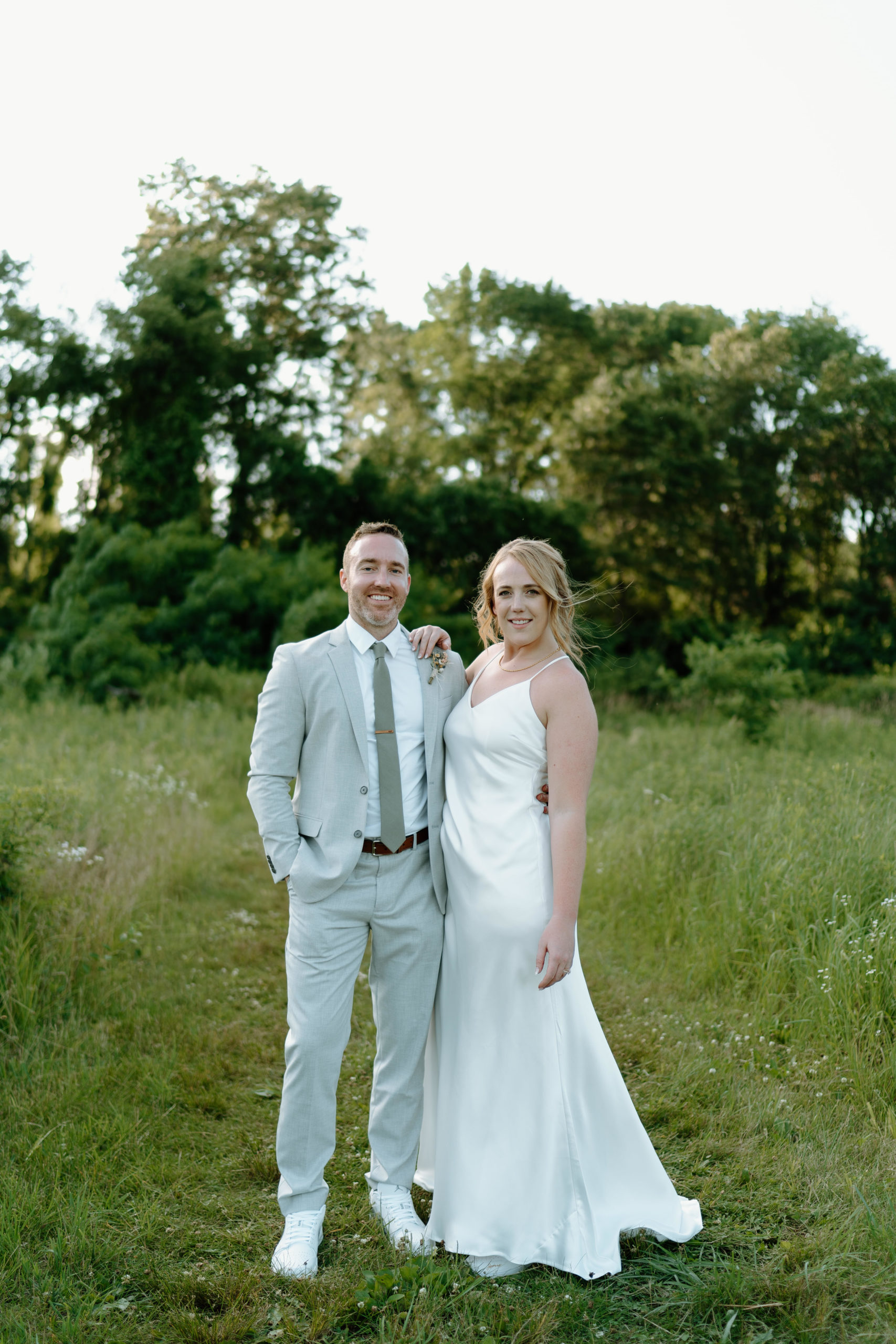 This is a bride and groom taking portraits on their wedding day at Indian Creek Nature Center in Cedar Rapids, IA