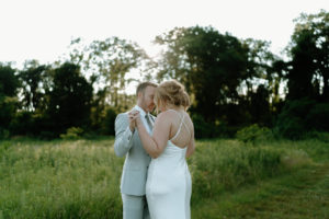 This is a picture of a bride and groom taking pictures together on their wedding day at Indian Creek Nature Center