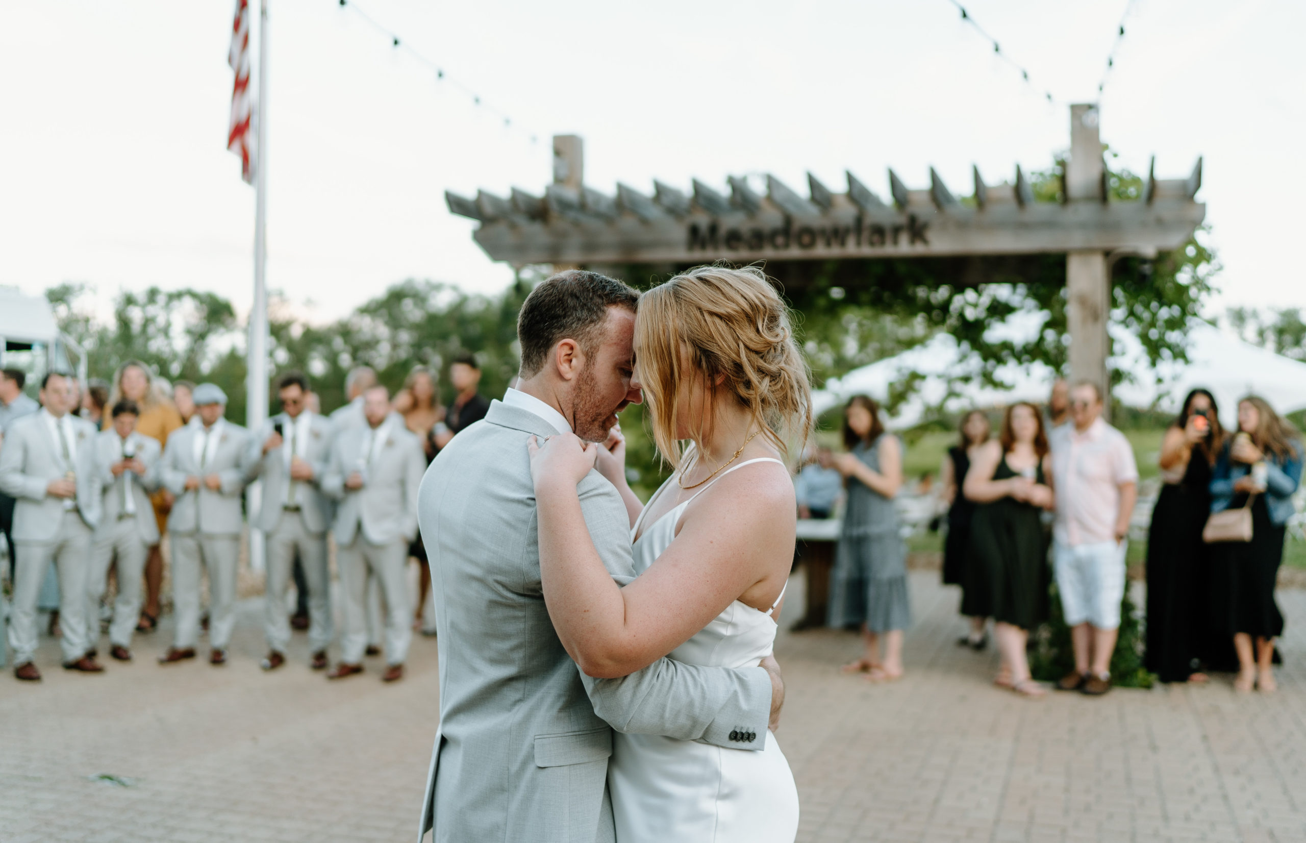 This is a bride and groom celebrating at their reception at Indian Creek Nature Center in Cedar Rapids, IA