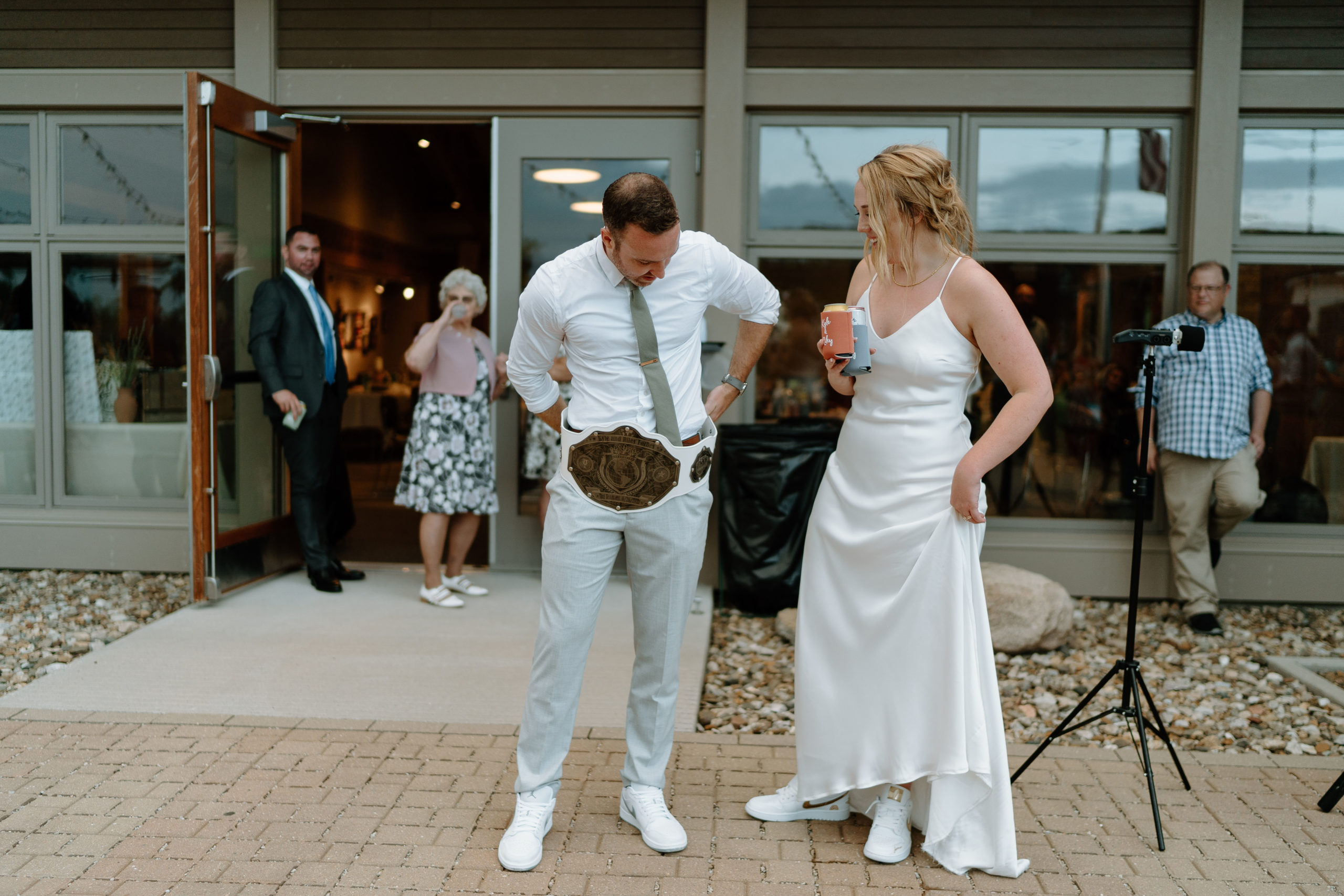 This is a bride and groom celebrating at their reception at Indian Creek Nature Center in Cedar Rapids, IA