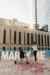 a proposal on top of a rooftop in downtown nashville