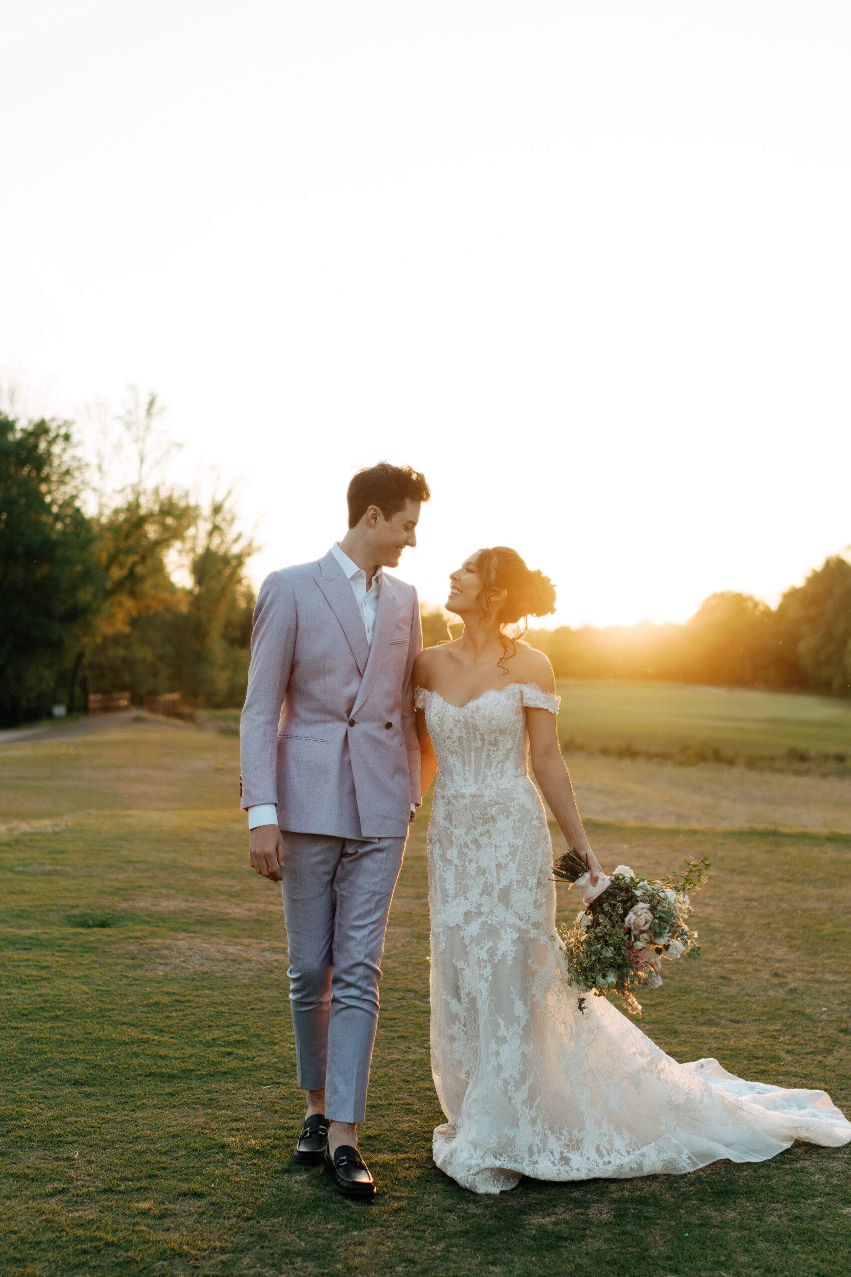 couple walking together during sunset at hermitage golf
